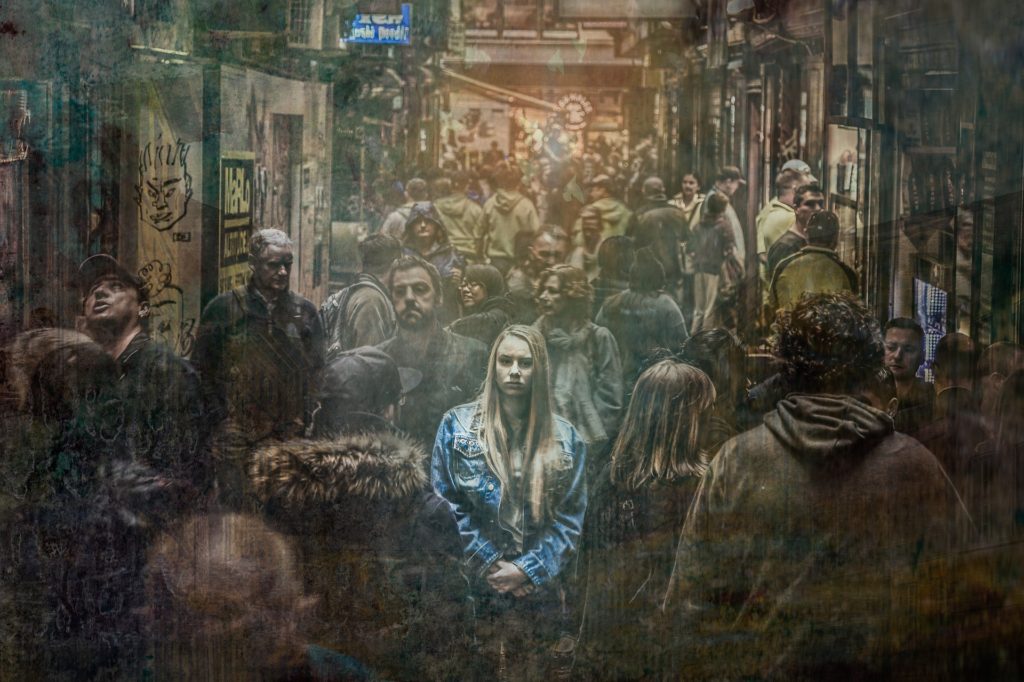 sad girl in a crowd