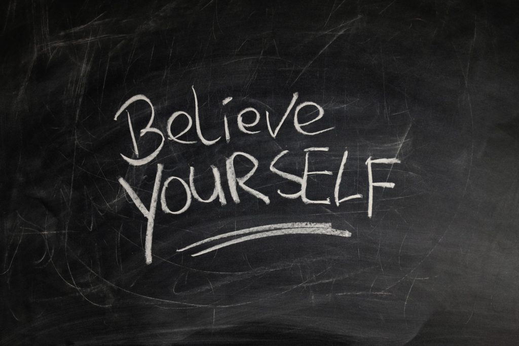chalkboard with the phrase 'believe yourself'
